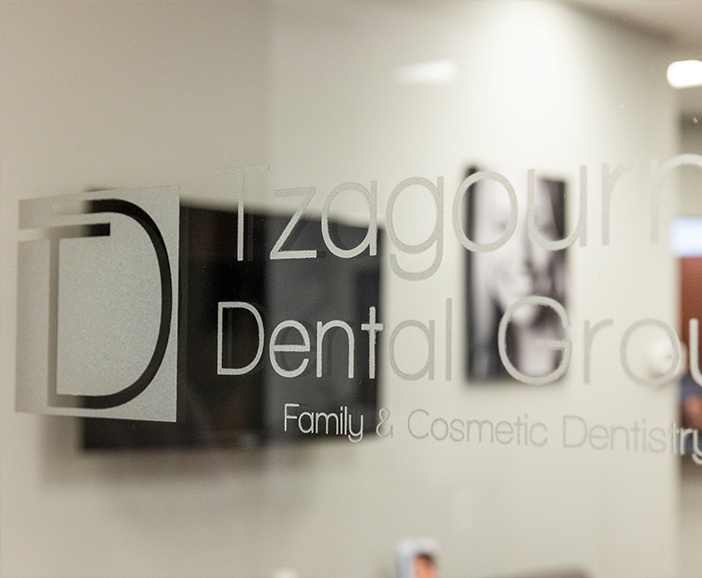 Tzagournis Dental Group of Upper Arlington logo on glass door