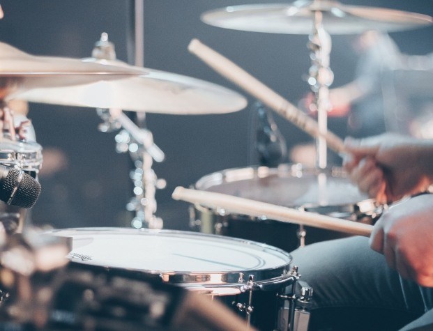 Close up of person playing drums