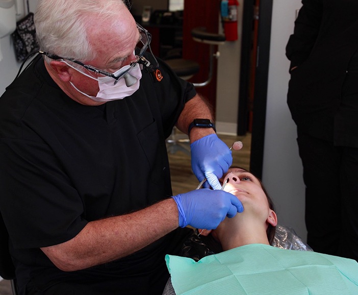 Dentist providing T M J treatment in Upper Arlington to a patient