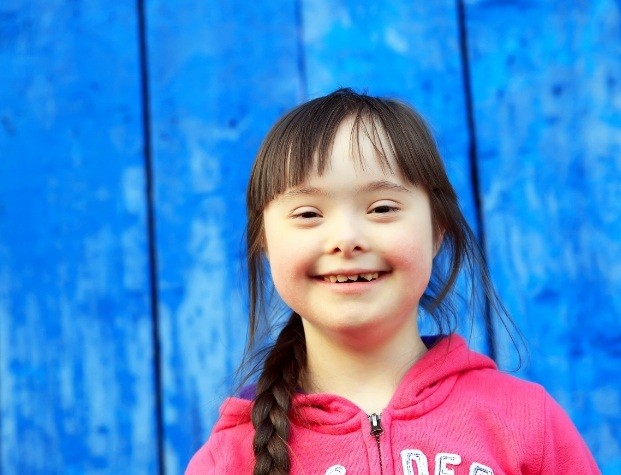 Young girl with special needs smiling