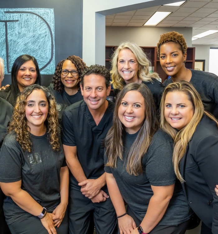 Group of smiling dental team members at Tzagournis Dental Group of Upper Arlington