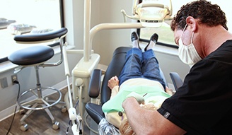 Doctor Tzagournis treating a dental patient